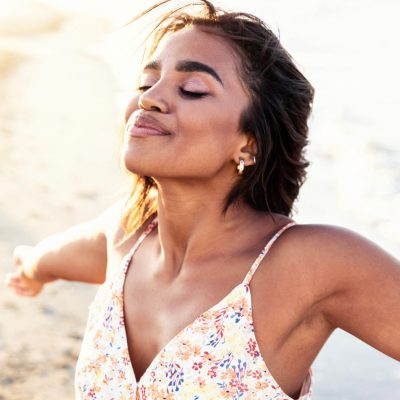 Free happy woman with open arms enjoying nature – Joyful black g Free happy woman with open arms enjoying nature - Joyful black girl outdoors breathing fresh air - Enjoyment, freedom, happiness and mental health concept